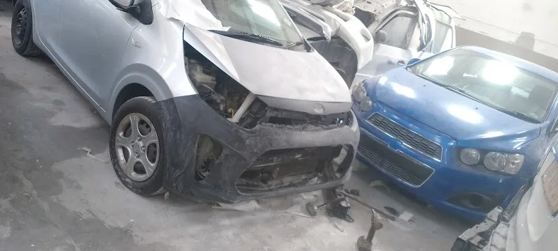 Collision damaged vehicles in for panel beating repair